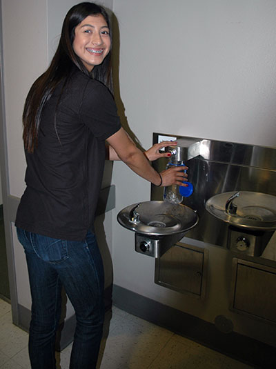 Girl at filling station at launch event in Merced, Calif.