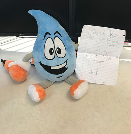 Wally the waterdrop-Agua4All mascot.