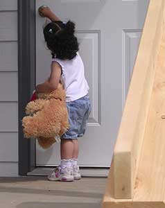 child opening door of her self help home