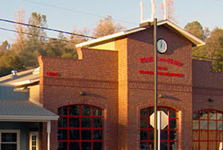 Red brick building with tall arched windows